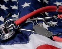 a stethoscope leaning on an american flag